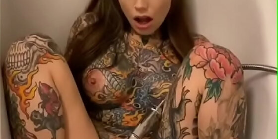 tatooed girl masturbates in bathroom