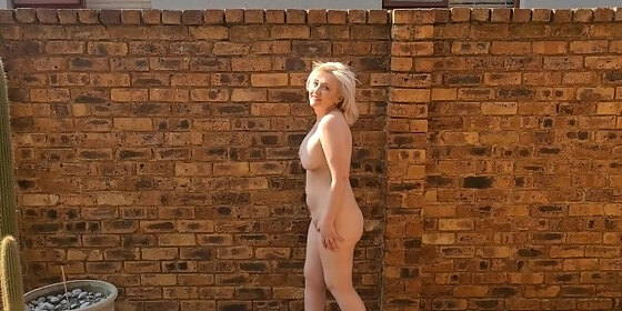 striptease and piss by chubby mature naked blonde outside in the garden courtyard