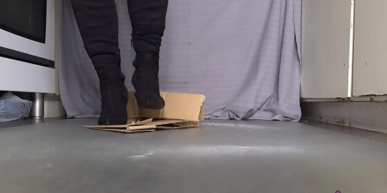puncture the cardboard box with stiletto boots